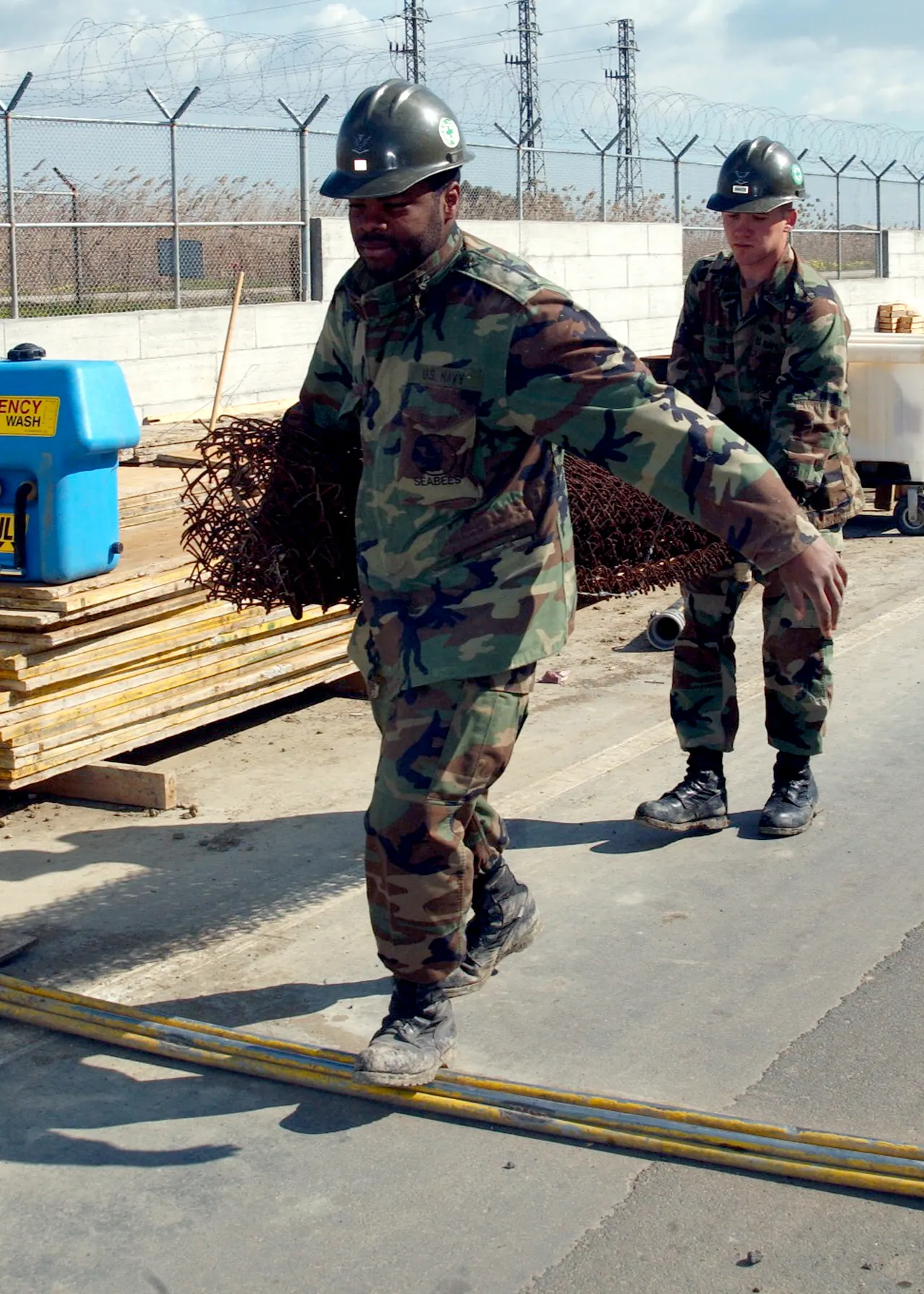 Sigonella, Sicily (Mar. 10, 2005) – Builder 3rd Class Joseph Ivy and Steelworker 3rd Class Joshua Baker, both assigned to Naval Mobile Construction Battalion One (NMCB-1), carry fe. Fence contractor KPIs owners should track monthly