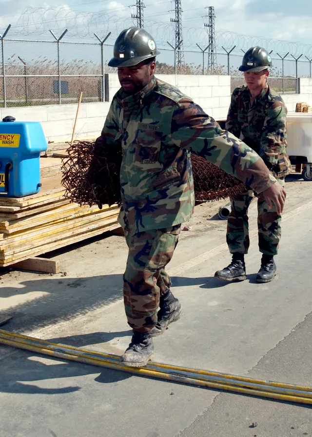 Sigonella, Sicily (Mar. 10, 2005) – Builder 3rd Class Joseph Ivy and Steelworker 3rd Class Joshua Baker, both assigned to Naval Mobile Construction Battalion One (NMCB-1), carry fe. Fence contractor KPIs owners should track monthly